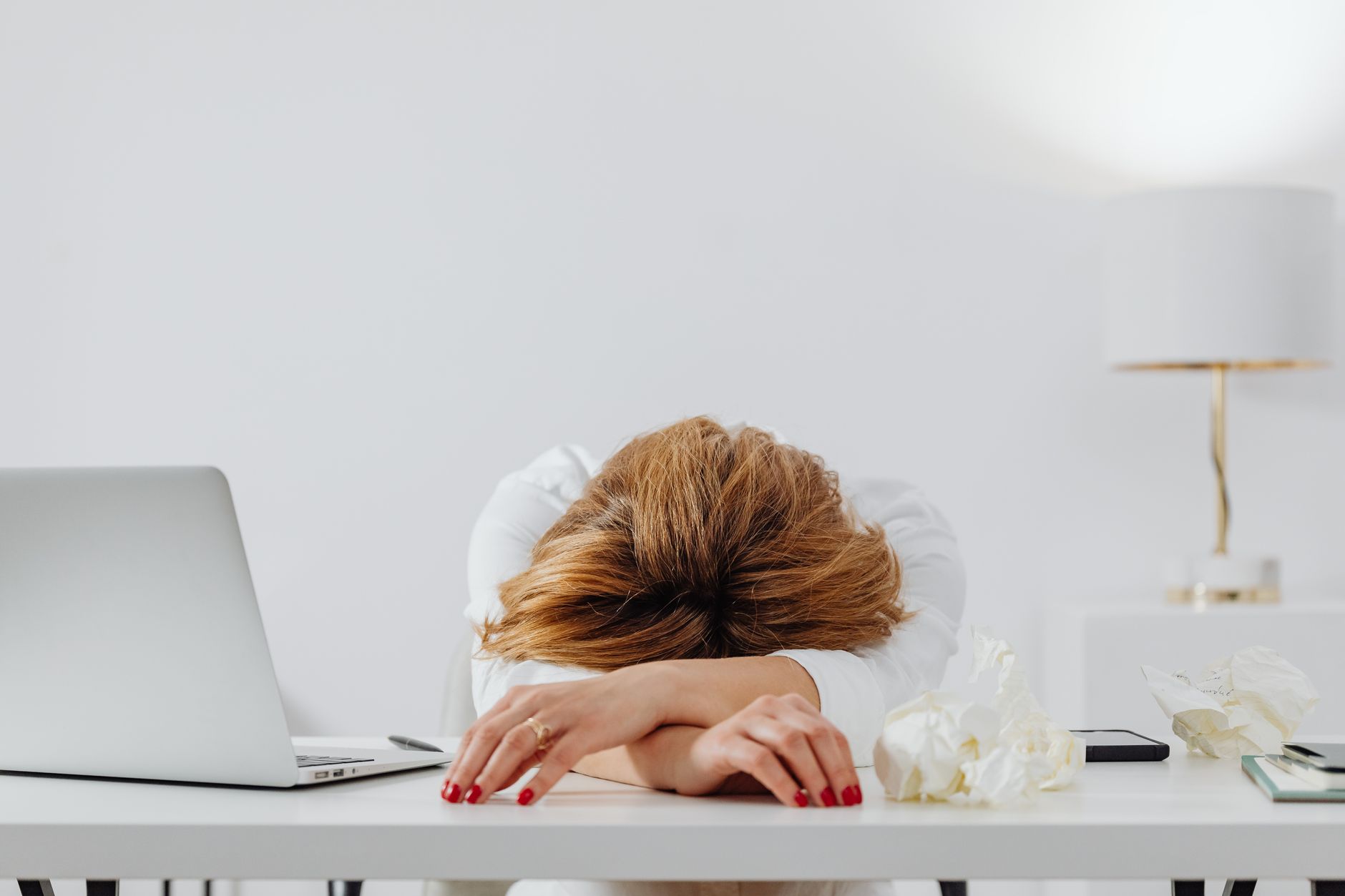 Exhausted person at their desk