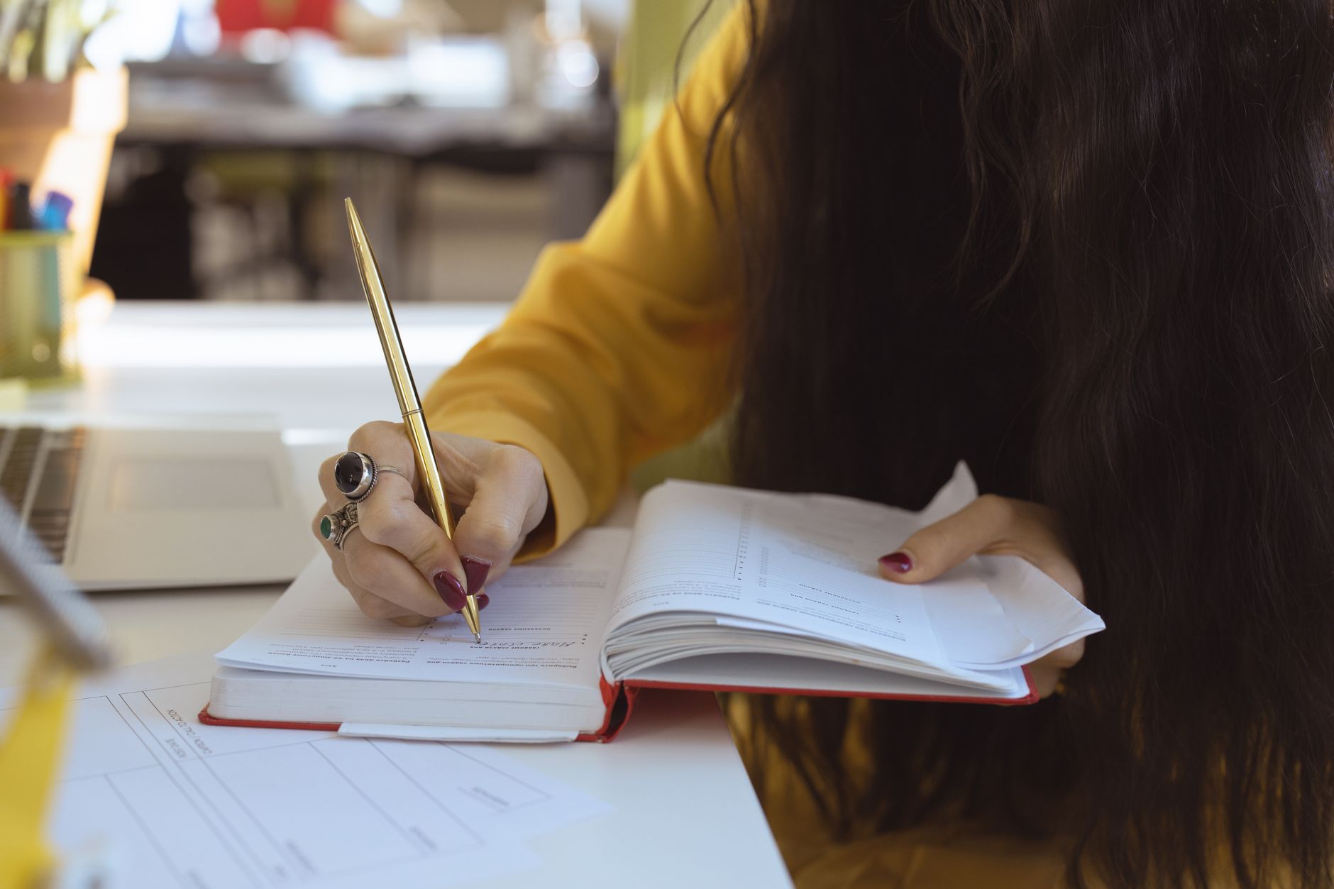 Adult using a planner to stay organized