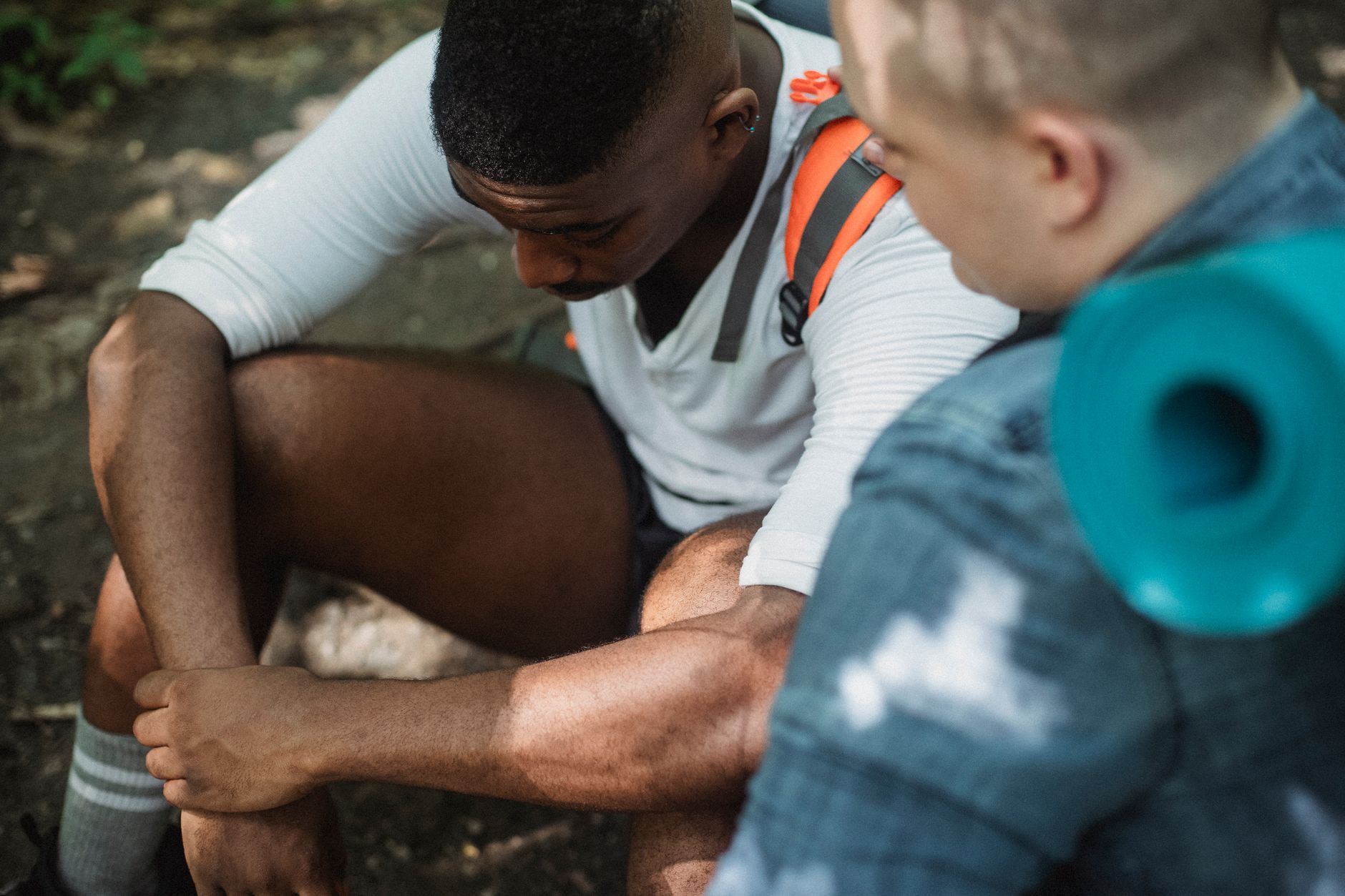 Friends having a supportive conversation outdoors