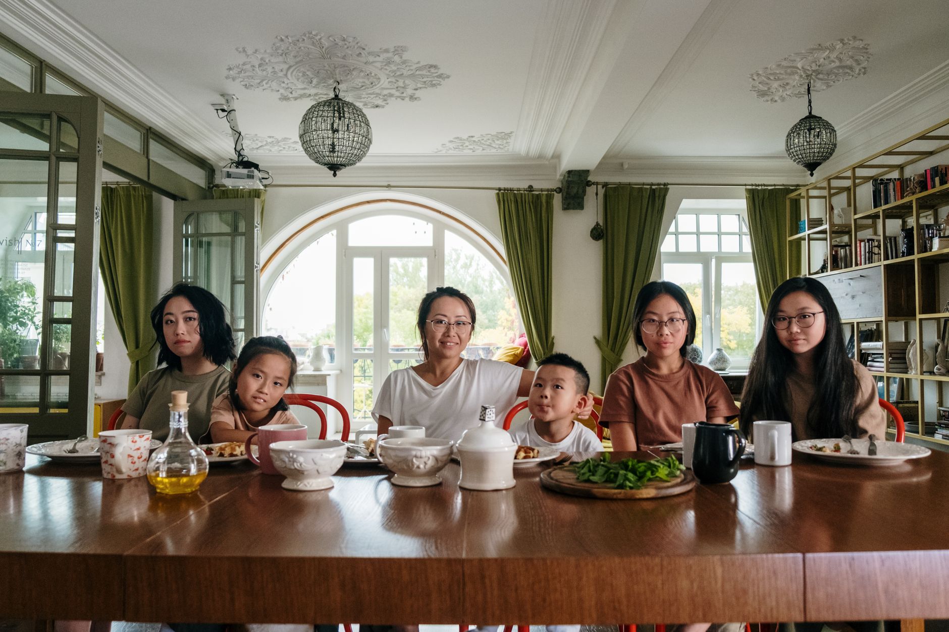 Family journaling and talking together at the table