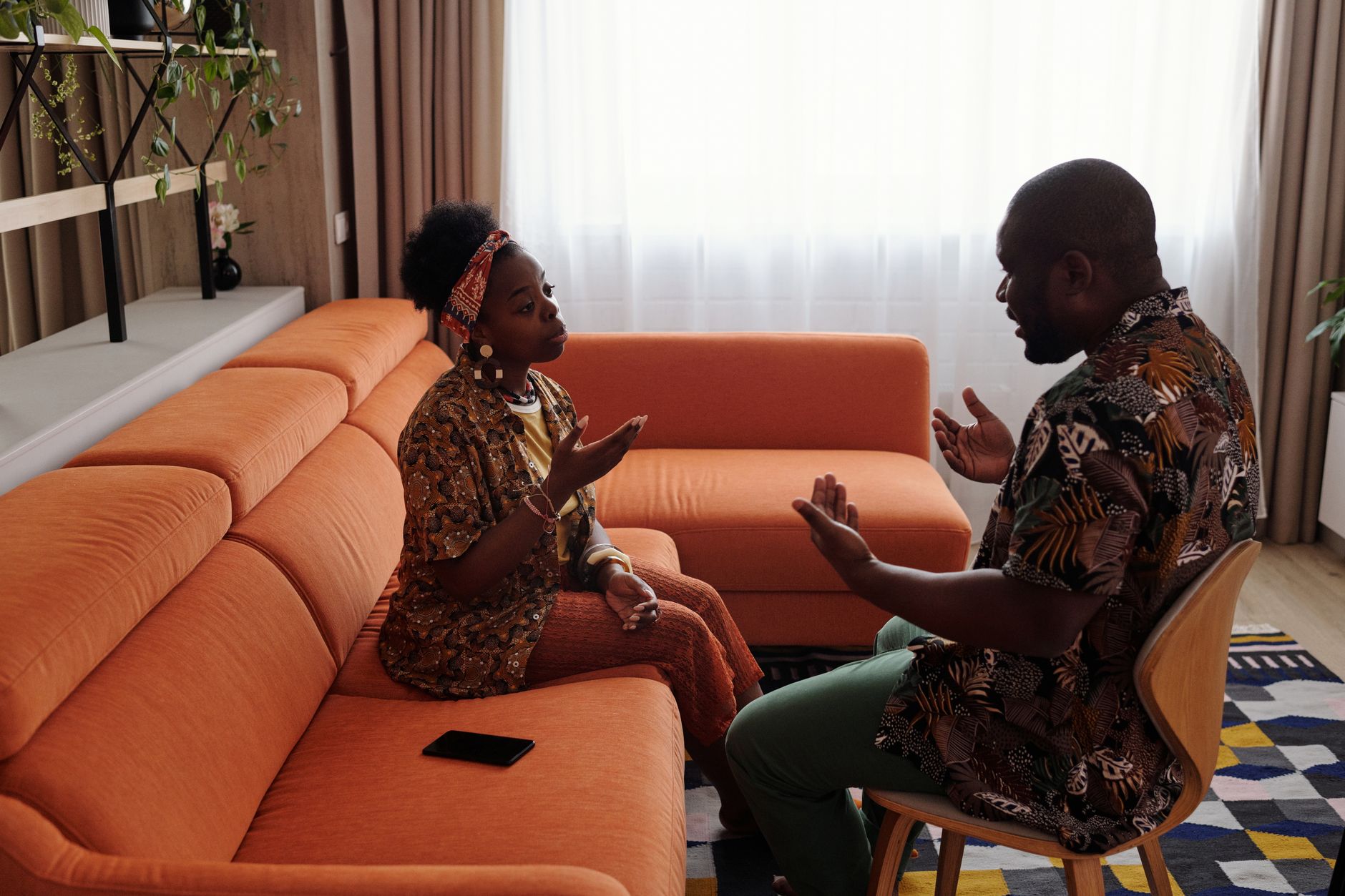 Couple having a meaningful conversation on the sofa