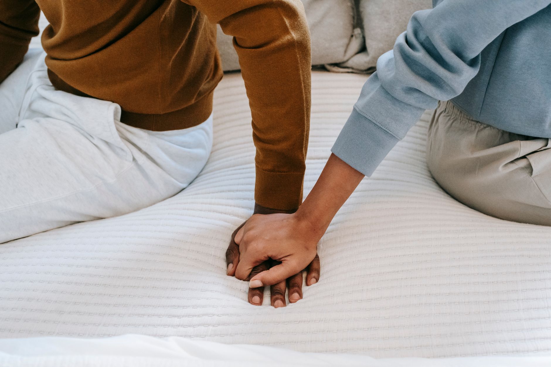 Couple holding hands, supporting each other