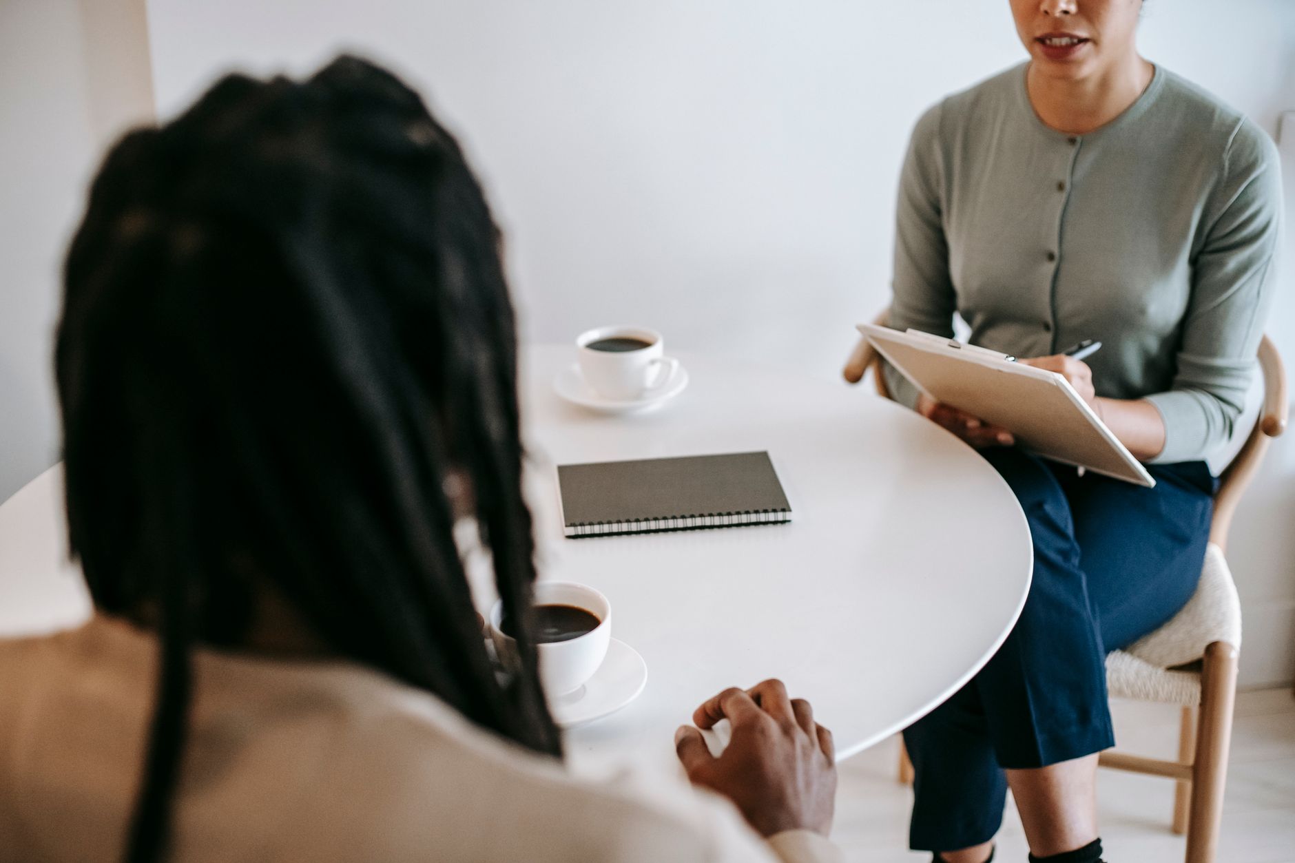 Therapist and client in a warm, understanding conversation