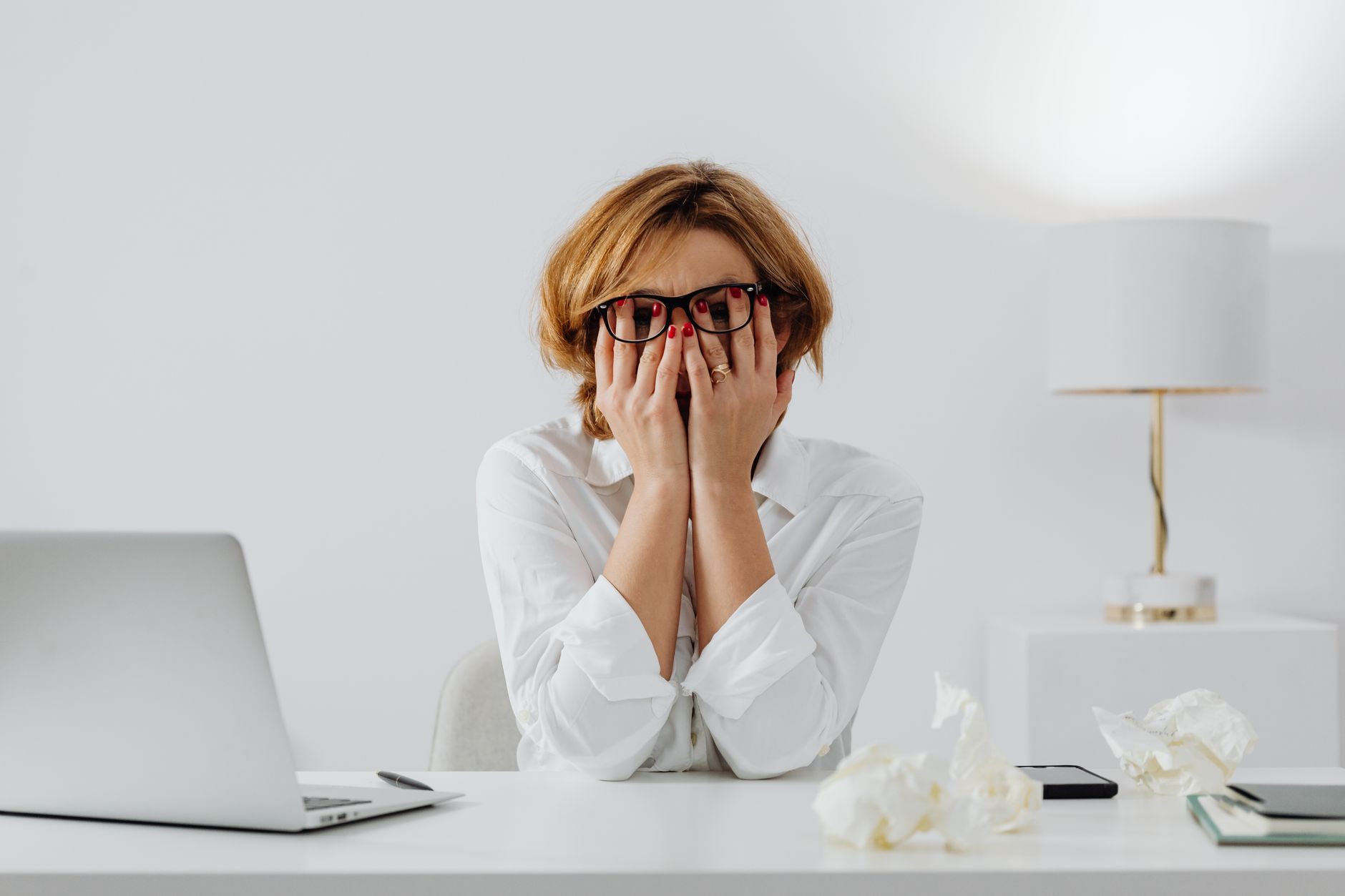 Person over-preparing and stressed at their desk