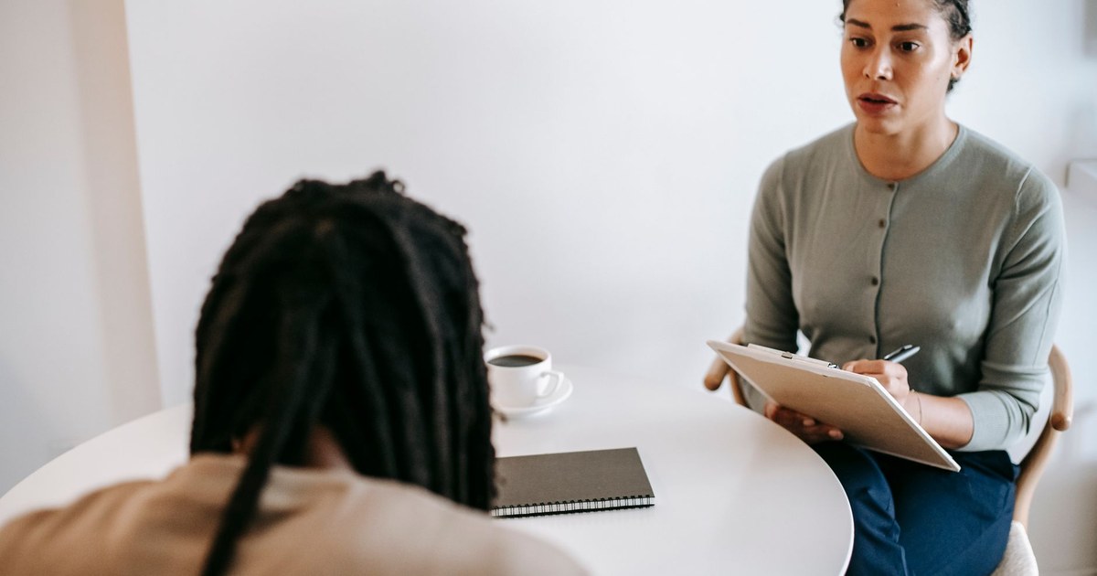 Two adults having a calm, supportive consultation conversation
