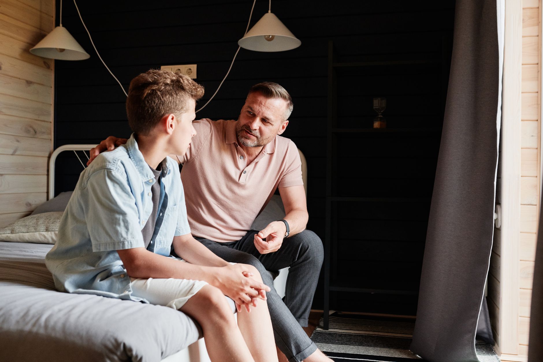 Supportive parent talking with teenager