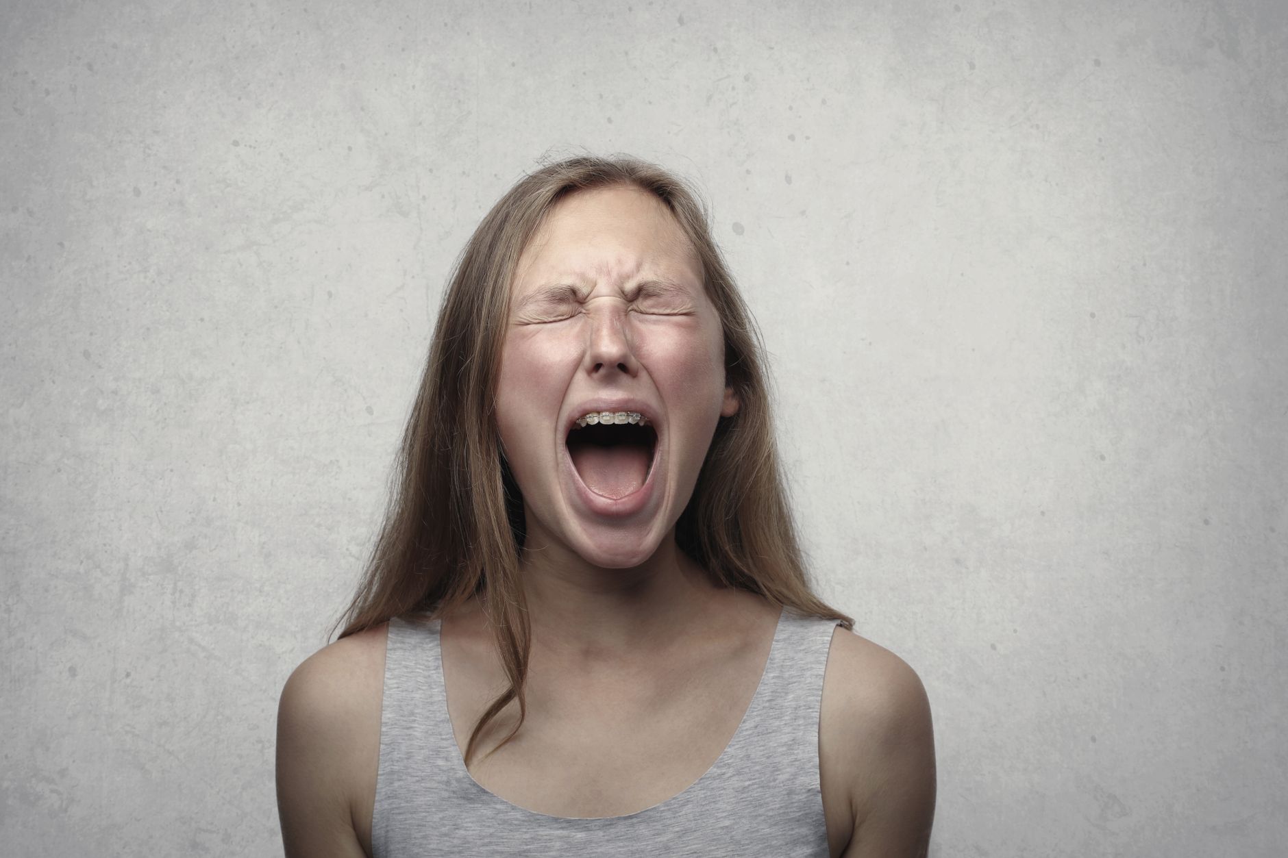 Frustrated teenager in their bedroom