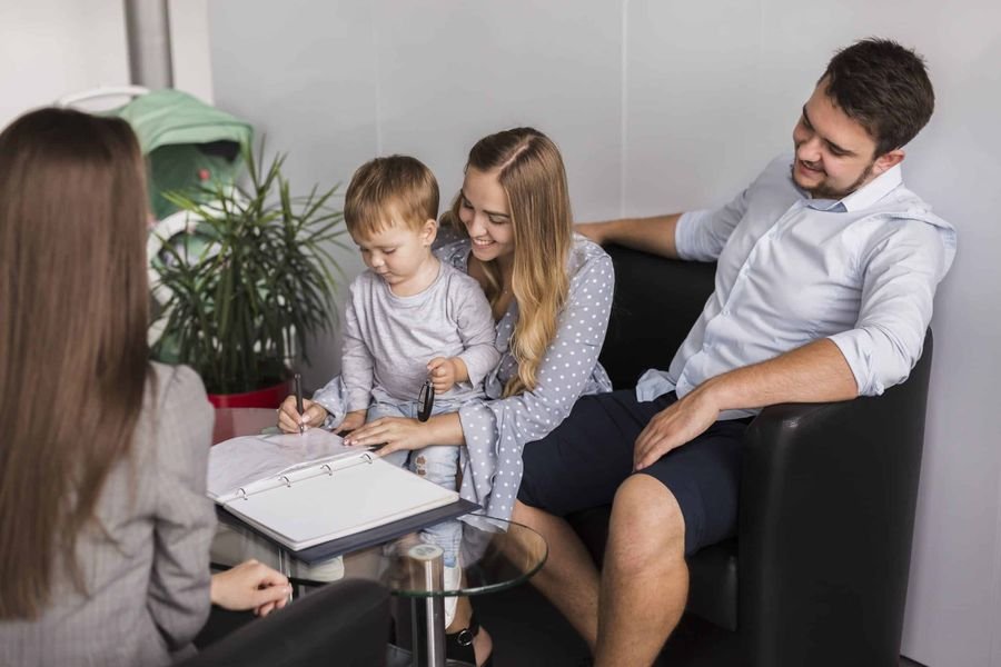 Family with a young child meeting with their therapist