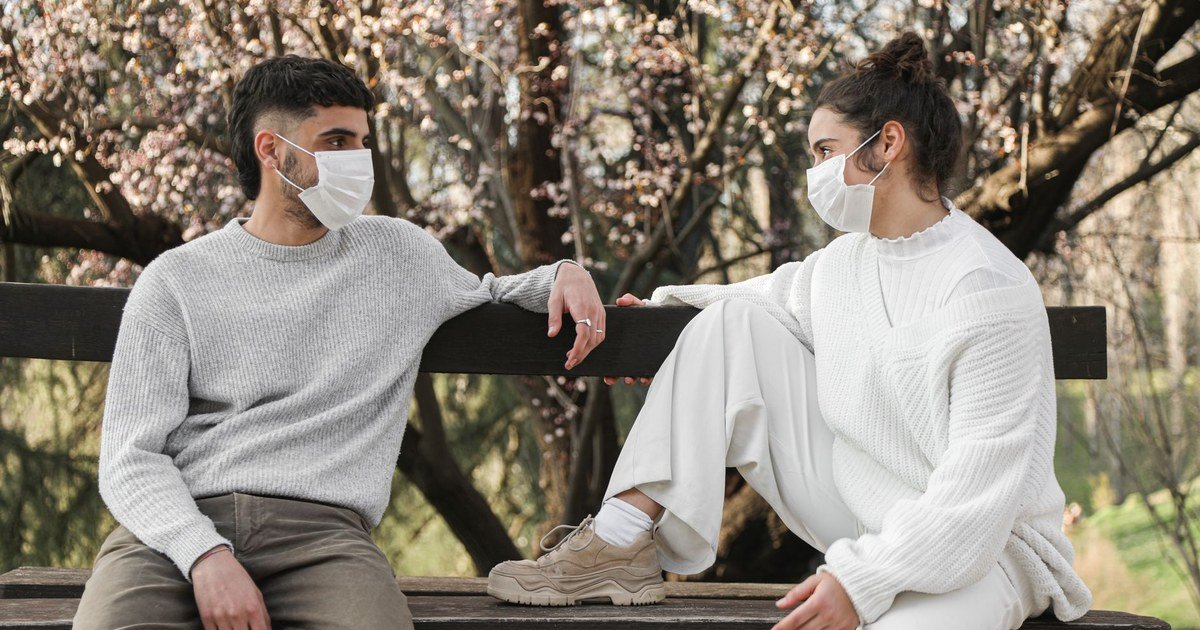Couple sitting together outdoors, having a calm and open conversation