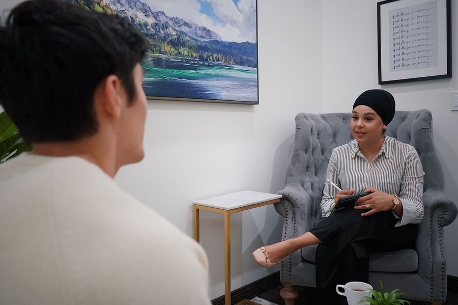 Teen comfortably talking with a therapist